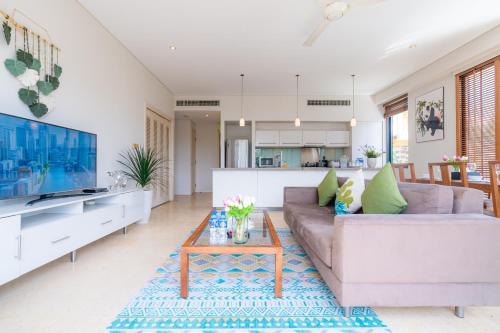 a living room with a couch and a table at Park view Avalon Apartment District 1 HCM City in Ho Chi Minh City