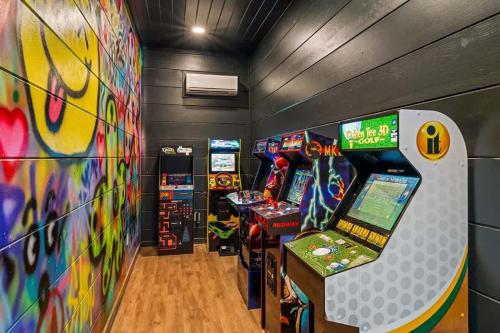 a room with arcade games and a video game console at Lake View Serenity - Indoor Pool - Arcade - Lake in Sevierville