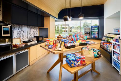a store with a counter with snacks on it at Aloft Montreal Airport in Dorval