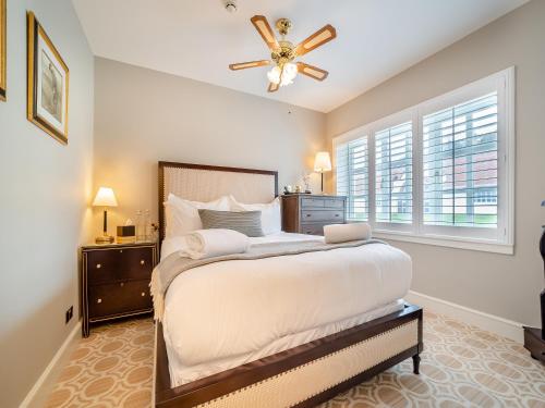 a bedroom with a large bed with a ceiling fan at Lundin Links - Ukc6916 in Turnberry