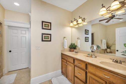 a bathroom with a sink and a mirror at Sea Point #307 in Saint Simons Island