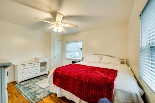 a bedroom with a bed and a ceiling fan at Walkable to FSU Campus Cozy Retreat with Deck! in Tallahassee