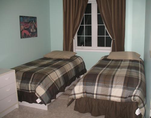 Postel nebo postele na pokoji v ubytování Gîte Parc Mauricie B&B