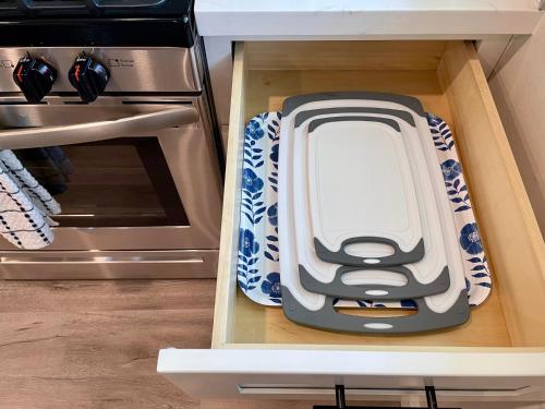a drawer in a kitchen with a plate in it at Bright Top Floor-King Bed-Parking-Fast Wi-Fi in Walnut Creek