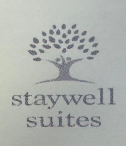 Staywell Suitesに飾ってある許可証、賞状、看板またはその他の書類