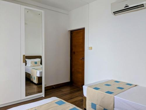 Ένα ή περισσότερα κρεβάτια σε δωμάτιο στο 3 Bedroom Apartment in Colombo 05, Pool, Gym, Rooftop