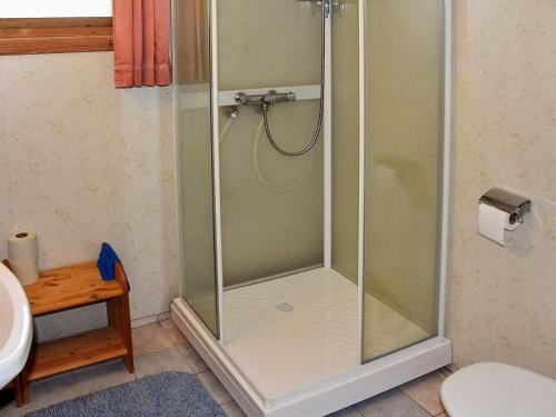 a shower with a glass door in a bathroom at 7 person holiday home in Selje-By Traum in Selje