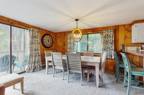 a dining room with a table and chairs at Ski Haus Retreat in West Dover