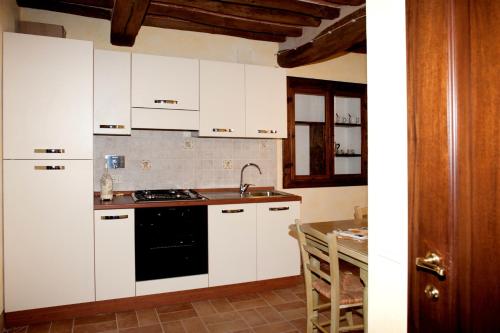 A kitchen or kitchenette at La terrazza di Susanna