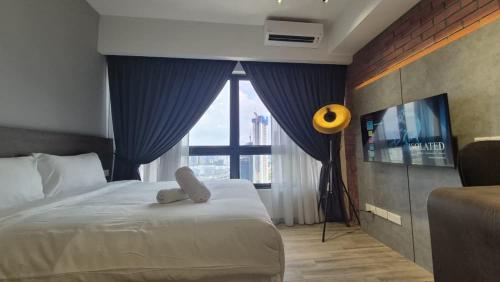 a bedroom with a bed with a teddy bear on it at Agile Pavillion TRX Luxury Suited Kuala Lumpur Good View in Kuala Lumpur