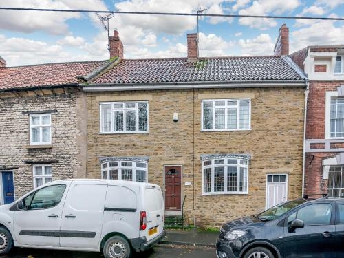 a white van parked in front of a brick house at Bow Cottage in Pickering