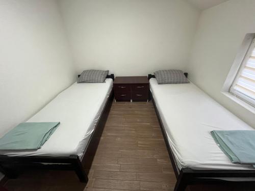 Postel nebo postele na pokoji v ubytování Vožd Apartmani