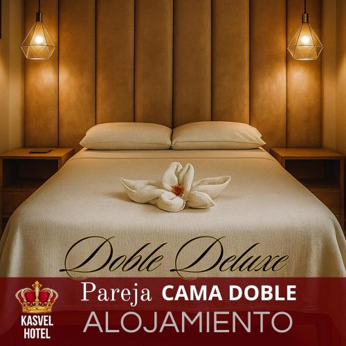 Postel nebo postele na pokoji v ubytování Hotel Kasvel