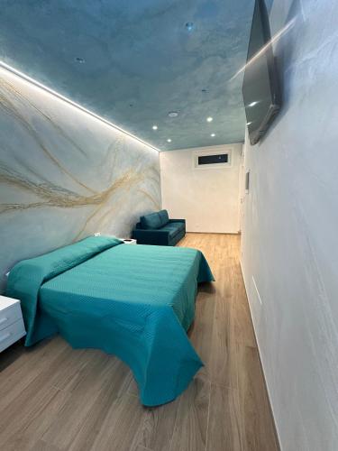 a bedroom with a bed and a wall with a mural at Starry Sky House in Mola di Bari