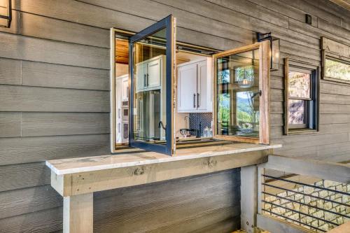 a bathroom with two mirrors on a wooden wall at Mountain Majesty - Views Style & Relaxation in Morganton
