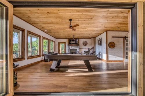 a large living room with a ping pong table at Mountain Majesty - Views Style & Relaxation in Morganton