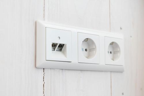 a white light switch on a white wall at Schwarzwaldstrand Ferienwohnungen in Bad Herrenalb