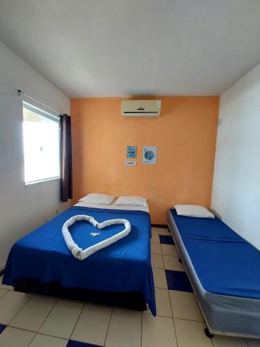 Postel nebo postele na pokoji v ubytování Pousada MARIA BONITA