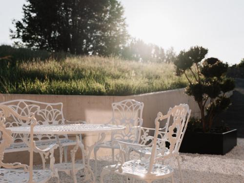 a table and chairs and a table and a table and chairs at Holiday Home Haus am Kogl by Interhome in Wies