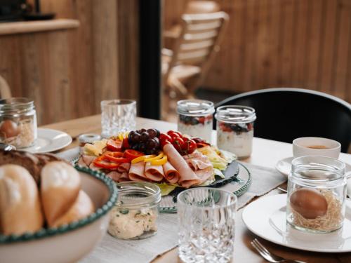 a table with a plate of food on it at Holiday Home Haus am Kogl by Interhome in Wies