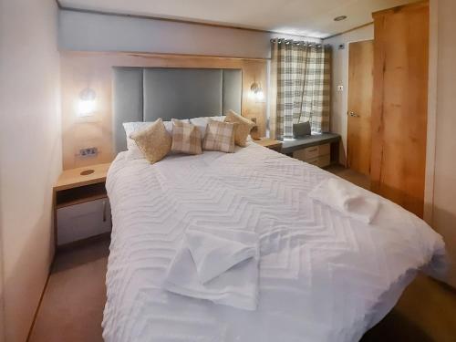 Ένα ή περισσότερα κρεβάτια σε δωμάτιο στο Ambleside Lodge