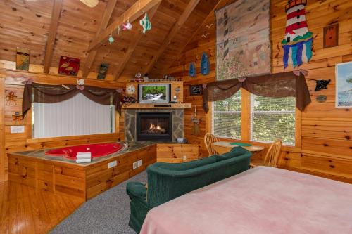a living room with a fireplace in a log cabin at Forever Yours by American Patriot Getaways in Cove Creek Cascades