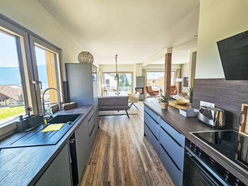 a kitchen with a sink and a counter top at Chalet Ossiacher See Chalet 2 by Interhome in Bodensdorf