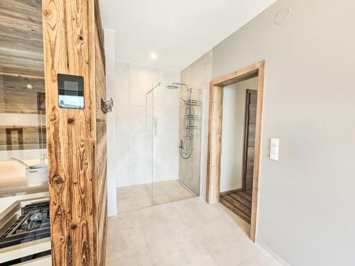 a bathroom with a shower and a walk in shower at Chalet Ossiacher See Chalet 2 by Interhome in Bodensdorf