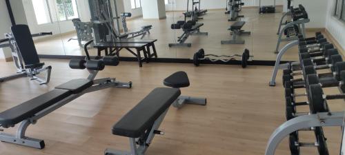 an overhead view of a gym with rows of exercise equipment at Majestic Sanctuary Homestay Taiping with Netflix - 2 Carpark in Taiping