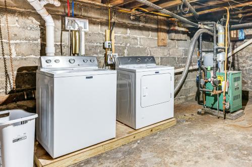 a laundry room with two washing machines in it at Stay and Play in Dtwn Stroudsburg Updated Townhouse in Stroudsburg