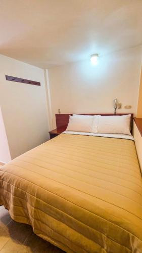 Postel nebo postele na pokoji v ubytování Juan Sebastián Hotel