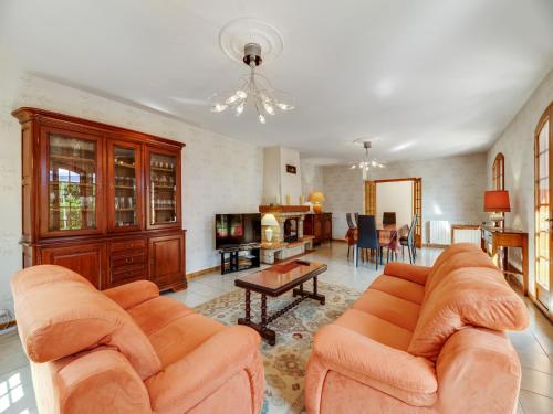a living room with two couches and a table at Dordogne Villa River Bliss in Pineuilh
