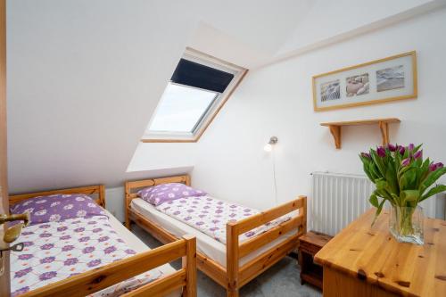 Giường trong phòng chung tại HER14b Ferienwohnung Hartig