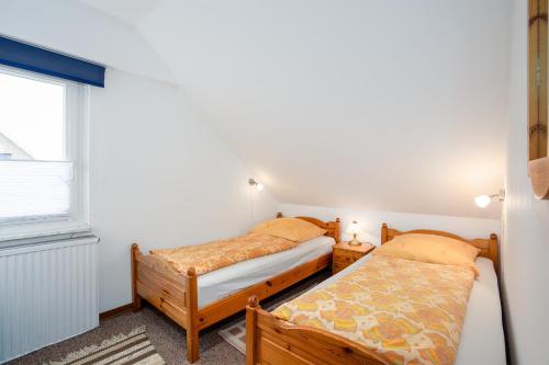 Giường trong phòng chung tại HER14a Ferienwohnung Hartig