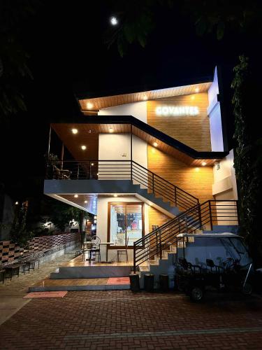 a building with a staircase in front of it at night at The Bistro House - Loft Unit - Vigan in Vigan