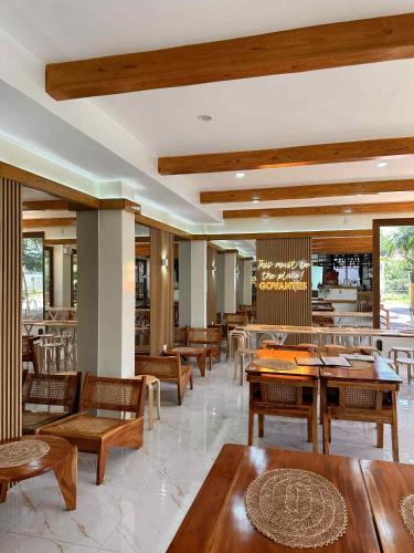 a restaurant with tables and chairs and a bar at The Bistro House - Loft Unit - Vigan in Vigan