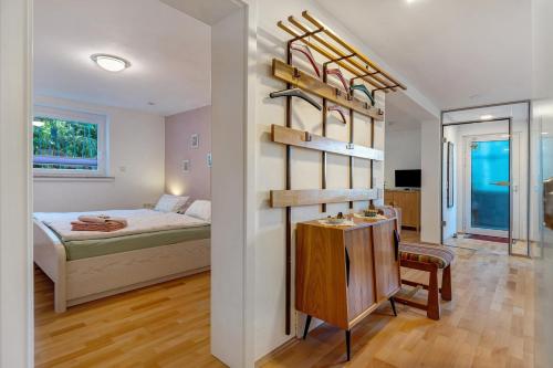 a bedroom with a bed and a room with a table at Ferienwohnung Lilly in Hofgeismar