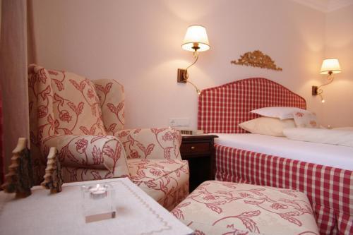 En eller flere senge i et værelse på Hotel Erzberg