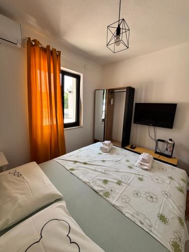 Ένα ή περισσότερα κρεβάτια σε δωμάτιο στο Apartment Marevic