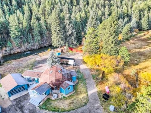 an aerial view of a large house with aestead at Riverside Tiny Home with Dynamite Views in Bailey