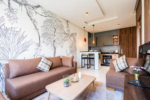 a living room with a couch and a table at Résidence Cerezo in Maarif