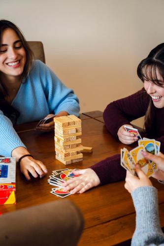 a group of people sitting around a table playing a game at Dpto. San Andrés, la mejor vista y ubicación in Cuenca