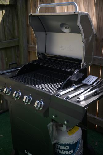 a grill sitting on top of a table at The Jungle Nook - Themed Getaway,Backyard,Grill in Savannah