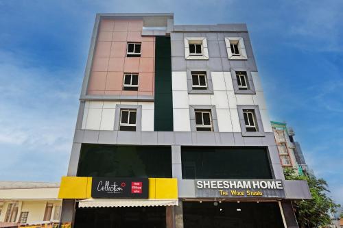 a tall building with a sign in front of it at Collection O SSR Royal Suites in Hyderabad