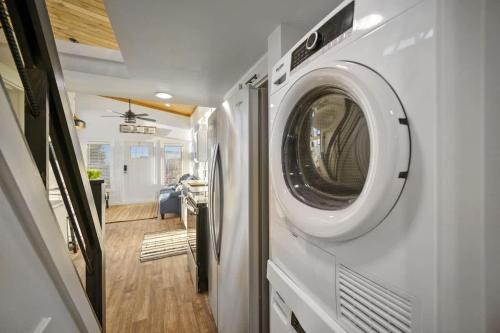 a washing machine on a wall in a house at Shadowrock - Luxury Tiny Home with Amazing Views in Yanush