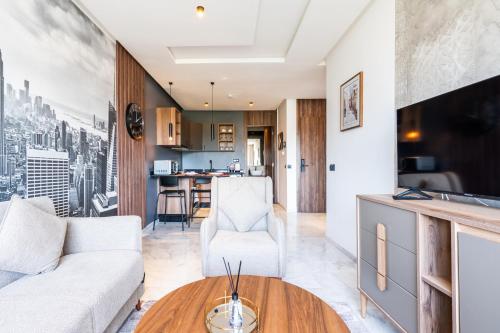 a living room with a couch and a table at Résidence Cerezo in Maarif