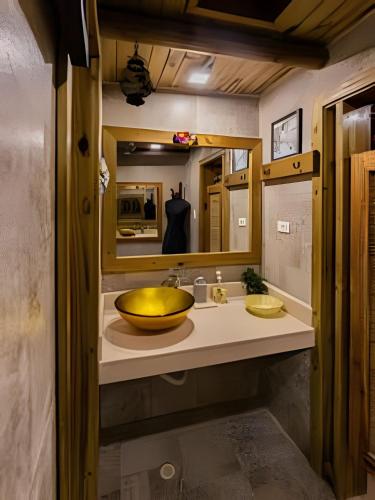 a bathroom with a large bowl sink on a counter at Tita Tati Disconnect near Cartagena in Punta Canoas