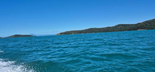 a view of the ocean from the back of a boat at DAINTREE RAINFOREST Private ROOM w-Ensuite In my 2 bdroom home in Cow Bay