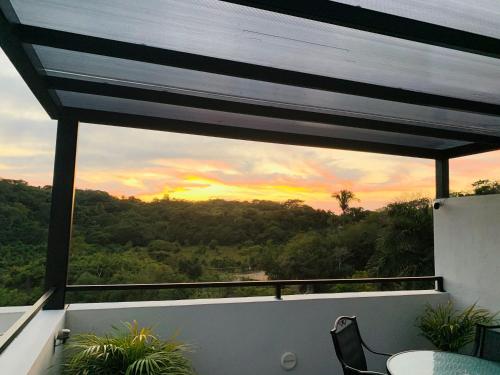 a view of a sunset from a balcony at Florence Sayulita in Sayulita