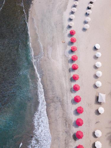 an aerial view of a beach with red and white chairs at Florence Sayulita in Sayulita